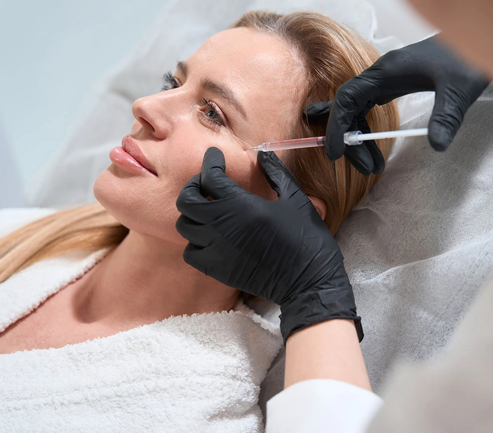 woman receiving filler injectable | Raggio Facial Plastic Surgery
